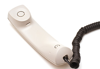 Image showing Telephone receiver and cord on white