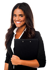 Image showing Pretty female secretary holding business files