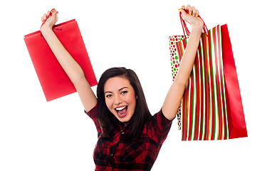 Image showing Joyous young girl enjoying her shopping