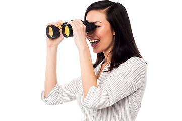 Image showing Corporate woman viewing through binoculars