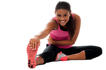 Image showing Fitness girl doing stretching exercise