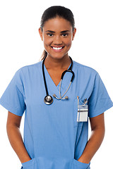 Image showing Young female doctor with hands in pocket