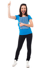 Image showing Excited young university student shouting loud