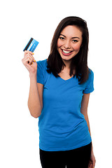 Image showing Smiling asian girl showing cash card