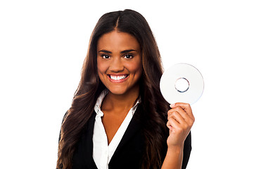 Image showing Attractive woman in formals holding CD