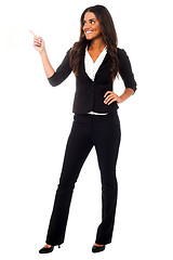 Image showing Young businesswoman pointing away