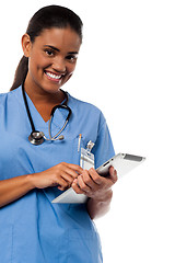 Image showing Female physician browsing on tablet pc