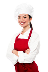 Image showing Cheerful confident young female chef