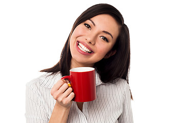 Image showing Woman enjoying coffee during work break