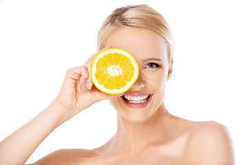 Image showing Blond woman with beautiful smile holding orange