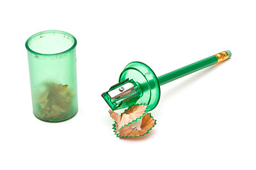 Image showing Green sharpener and pencil on white background.