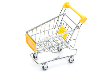 Image showing Yellow shopping cart on white