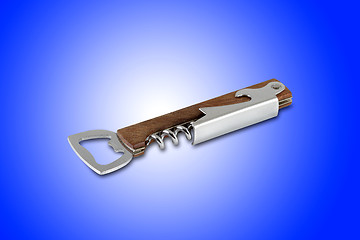 Image showing Corkscrew and bottle opener tool, isolated on blue background