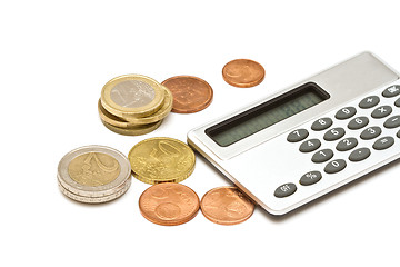 Image showing Several euro coins and calculator on white background