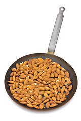 Image showing Pan with roasted almonds on white background