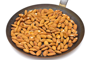 Image showing Pan with roasted almonds on white background