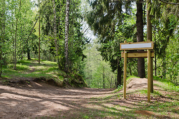 Image showing Wooden sign board on the natural trail. In the 
 forest park