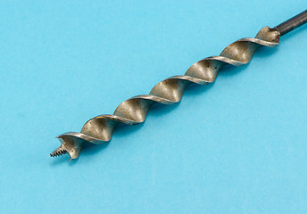 Image showing special wood drill bit on blue background 