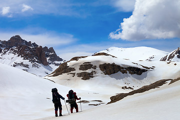 Image showing Two hikers in snow mountains