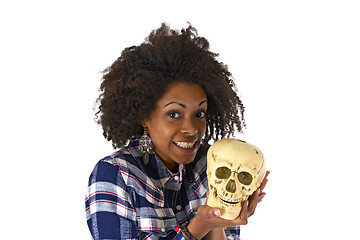 Image showing Female afro american woman with human skull model