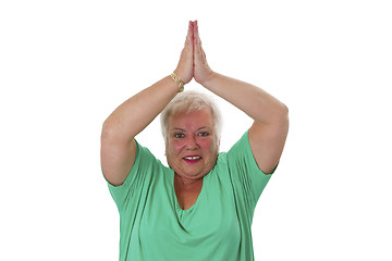 Image showing Female senior in yoga meditating 