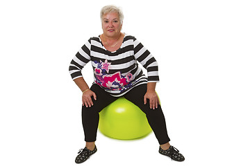 Image showing Female senior sitting on swiss ball