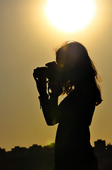 Image showing silhouette of girl in shooting time