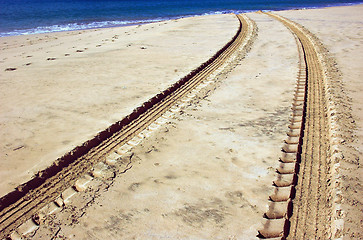 Image showing Vehicle tracks in the sand on the beach