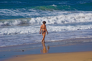 Image showing Beach female walking on a sunny day