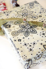 Image showing Giftwrapped box with floral paper