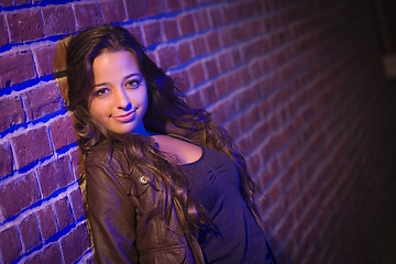 Image showing Pretty Mixed Race Young Adult Woman Against a Brick Wall