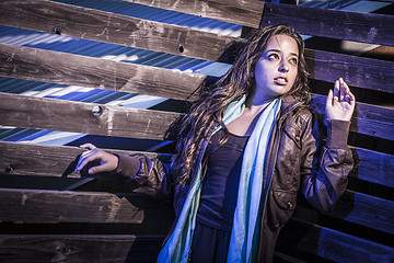 Image showing Frightened Pretty Young Woman in Dark Walkway at Night