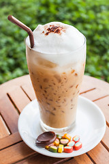 Image showing Refreshing iced milk espresso and some sweet