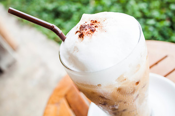 Image showing Refreshing glass of iced blended frappucino with milk foam