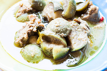 Image showing A bowl of spicy green curry with chicken and eggplant