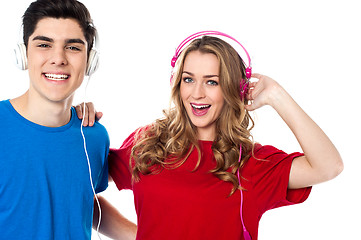 Image showing Adorable young couple enjoying music