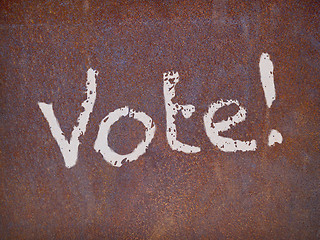 Image showing vote sign on a rusty steel plate