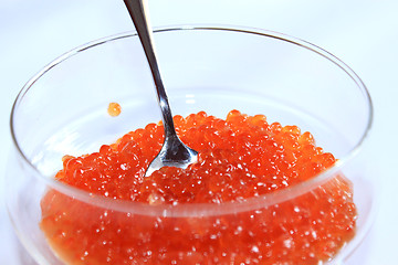 Image showing red caviar in a plate with the spoon