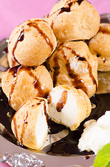 Image showing Profiteroles with chocolate syrup