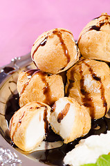 Image showing Profiteroles with chocolate syrup