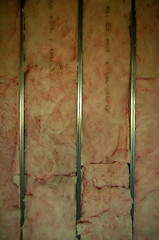 Image showing building wall exposed steel studs with insulation