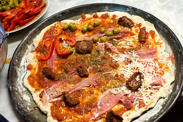 Image showing raw pizza and ingredients