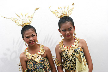 Image showing Happy girls in bright traditional dress during a parade in Phuke