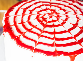 Image showing Fresh whipped cream cake decorated rasberry sauce 