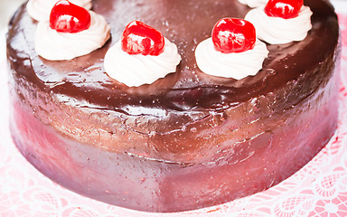 Image showing Fresh bake chocolate cake with cherry and whipped cream 