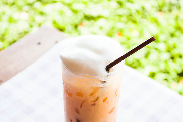 Image showing Break time with cold thai milk tea 