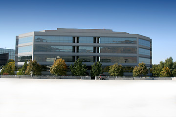 Image showing Mirrored Business Building and Parking Lot