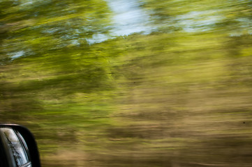 Image showing blurred out country landscape while driving