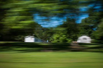 Image showing blurred out country landscape while driving