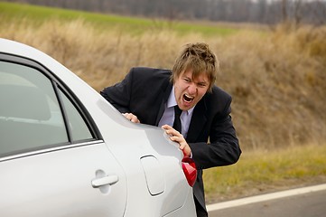 Image showing Pushing car